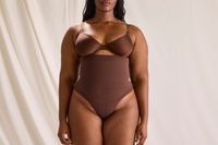 The front view of a woman wearing the SKIMS Core Control Thong
