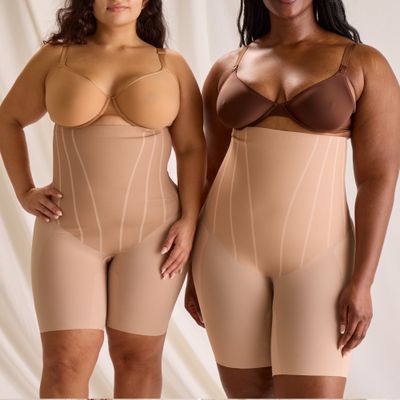 Two women testing out bridal shapewear