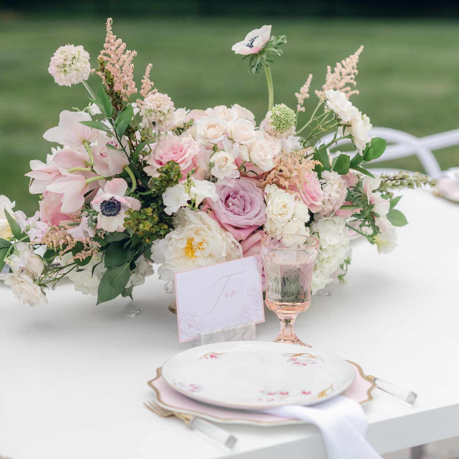 Tablescape With Floral Plates and Floral Centerpieces