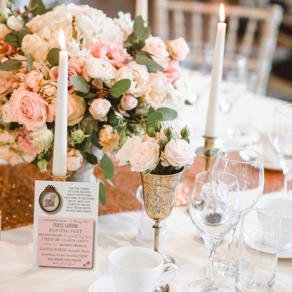A bridal shower reception table with pink flowers.