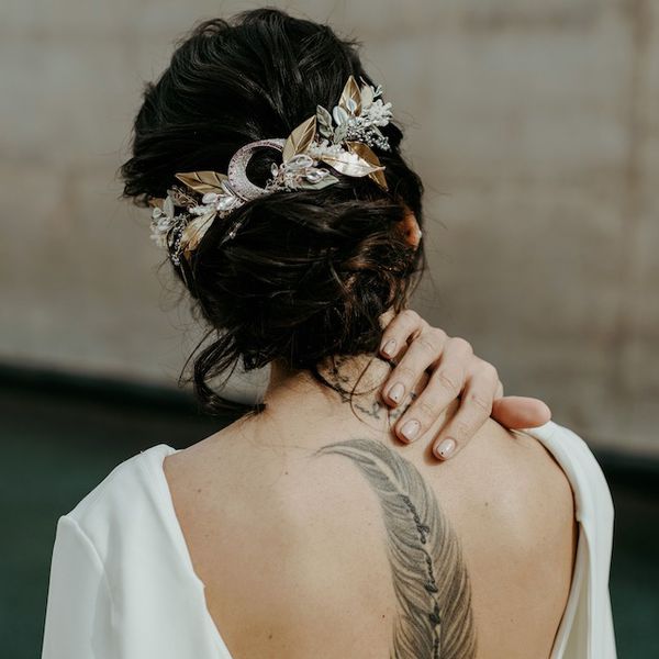 Ethereal bride with tattoo down back spine