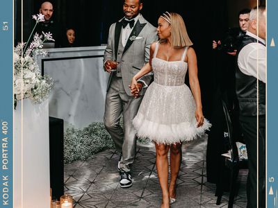 Bride in Short Wedding Party Gown and Groom in Gray Tuxedo