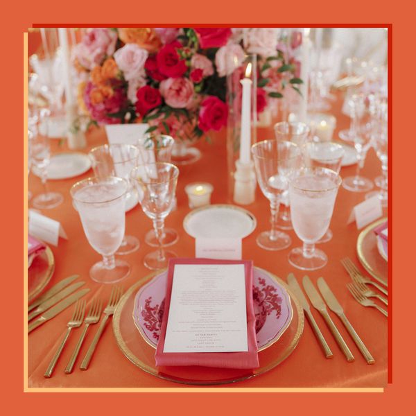 Verona Sunset Themed Wedding Reception Table with Hot Pink Table Settings and Flower Decor