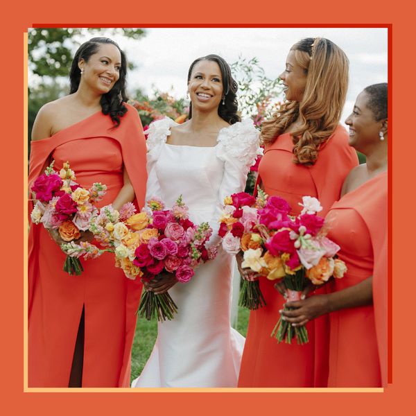 Bride in Wedding Dress Posing With Bridesmaids in Verona Sunset Dresses Holding Colorful Bouquet