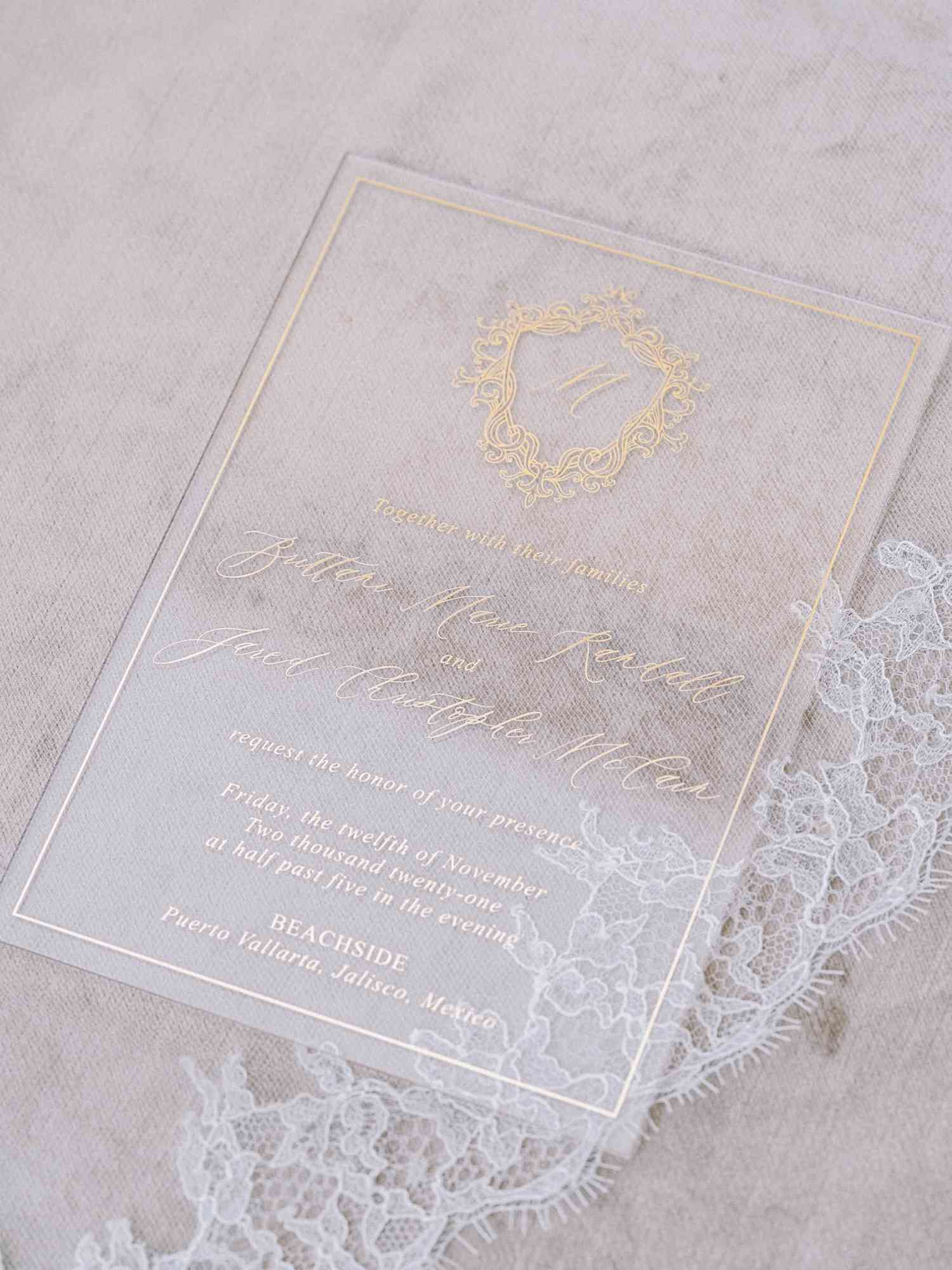 Brittani and Jared's glamorous acrylic invitations with gold font