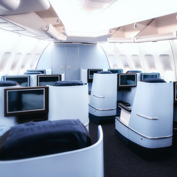blue business class seats on modern airplane