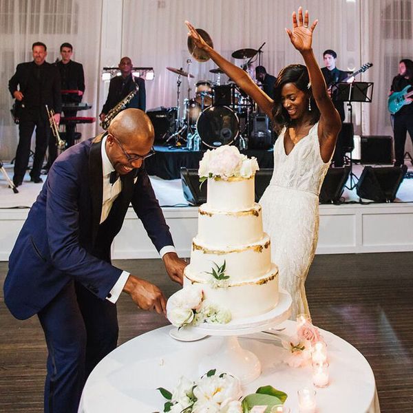 bride and groom cutting cake