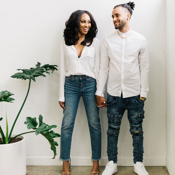 couple holding hands while wearing matching outfits