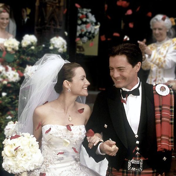 Sex and the City Charlotte York and Trey MacDougal on their wedding day smiling and holding hands