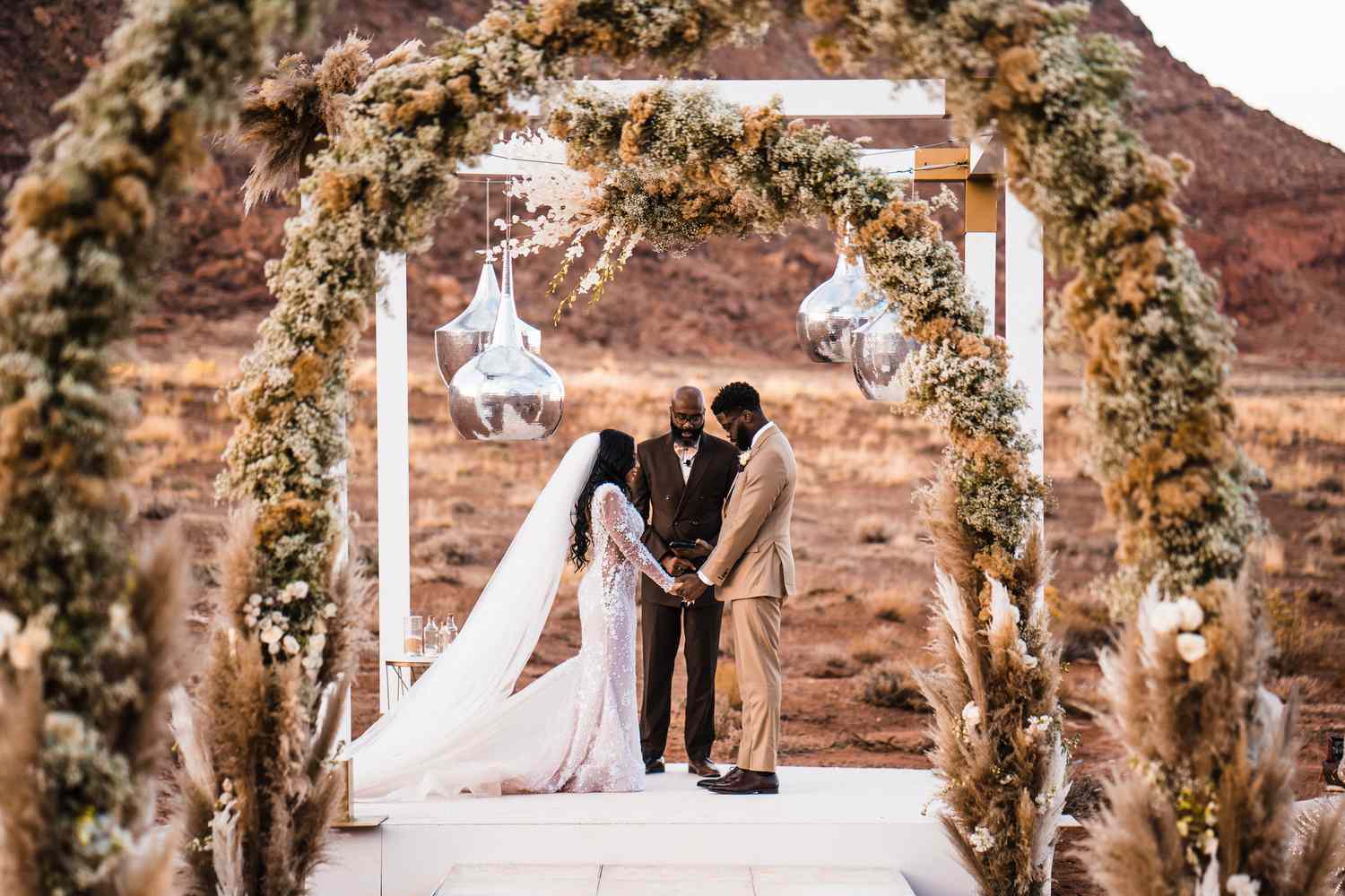 ceremony with lanterns and dried grass installations