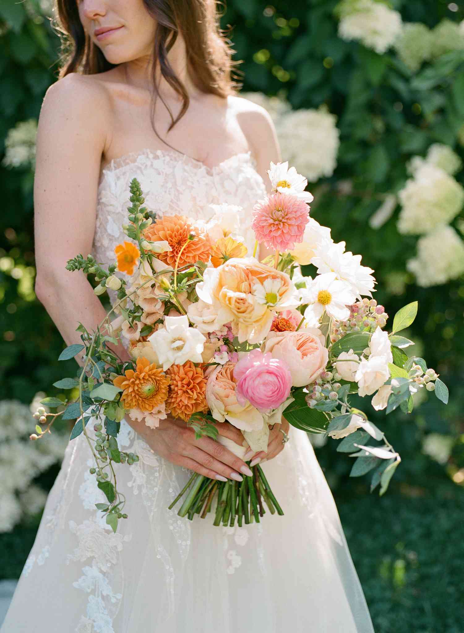 Brunette in Strapless Lace Wedding Dress With Pastel Bridal Bouquet