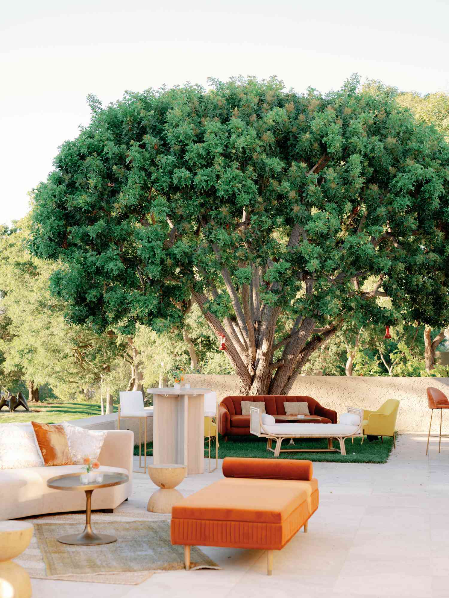 Outdoor Lounge Area With Velvet Furniture in Red, Orange, and Yellow