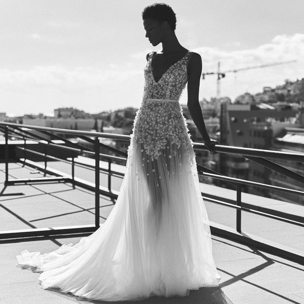 Sheer Tulle Wedding Dress With Straps and Small Floral Details on Body