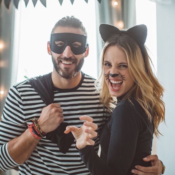Couple in Robber and Cat Halloween Costumes