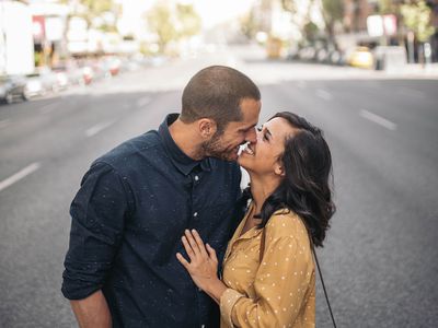Smiling couple of lovers having fun in the street.