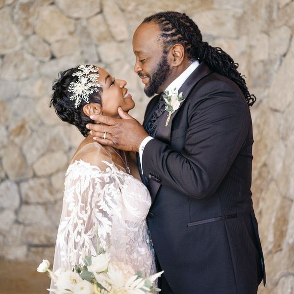 Bride and groom smiling at each other and gazing into each other's eyes