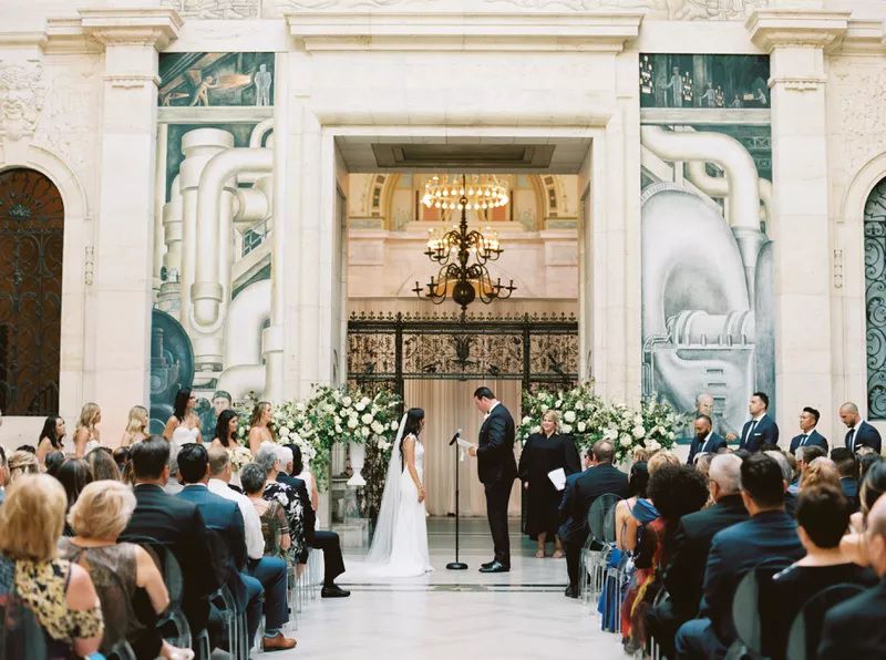 Bride and groom during a wedding ceremony at the Detroit Institute of the Arts