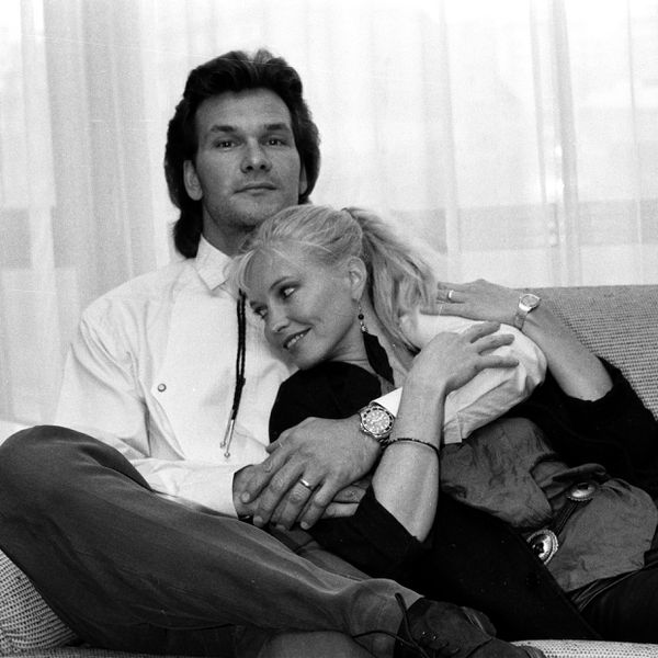 Black and White Photo of Young Patrick Swayze and Lisa Niemi Swayze Holding Each Other on Couch