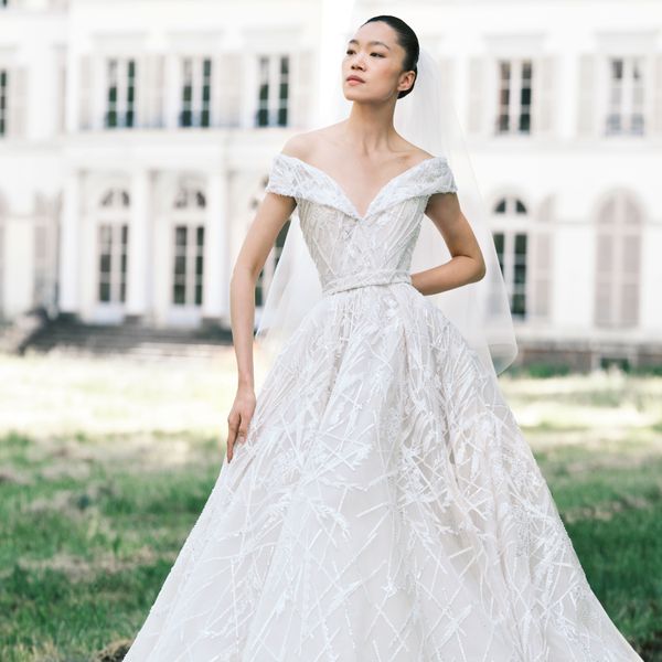 Model in Off-the-Shoulder Ball Gown Wedding Dress With Sparkles