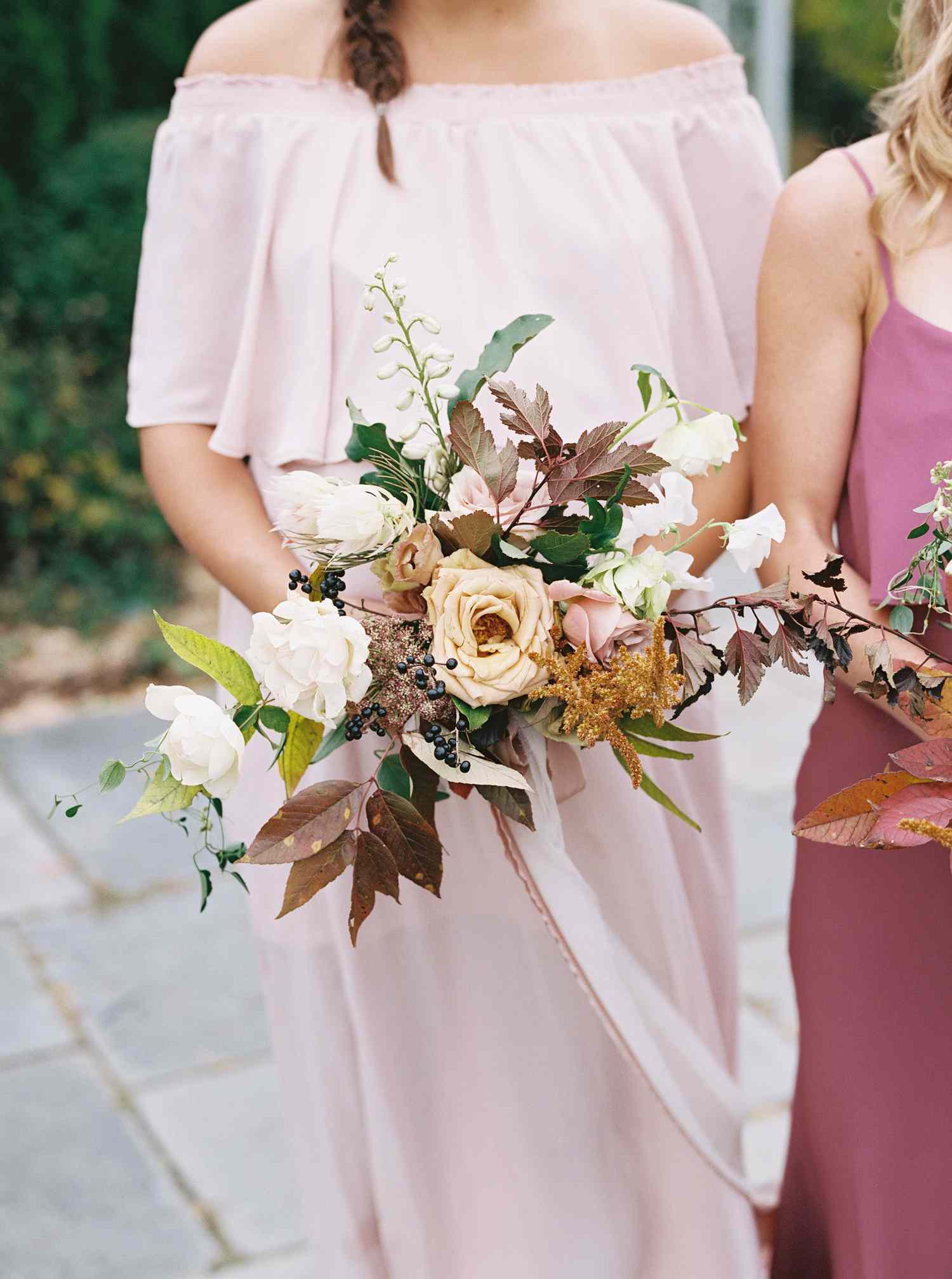 Bridesmaid bouquet consisting of hellebores, Queen Anne's lace, and maidenhair fern