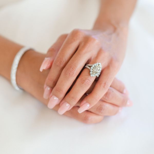 close up shot of a bride's hand and engagement ring