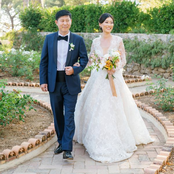 father of the bride walking his daughter down the aisle