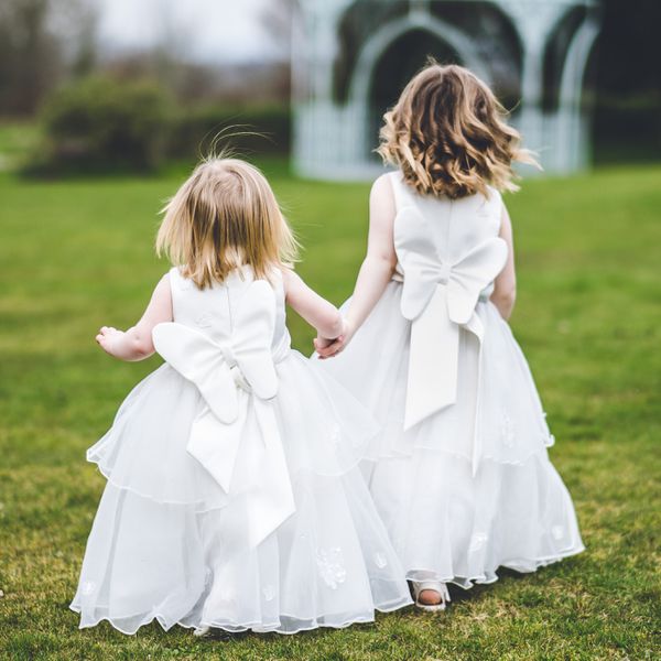 flower girls holding hands