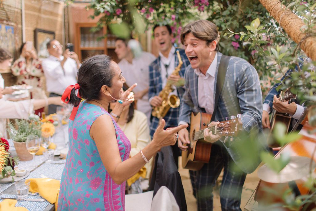 Lebanese wedding with musicians playing guitar and trumpet and guests dancing