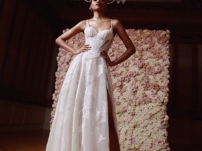 Model in Floral-Embroidered Wedding Dress With Corset Top