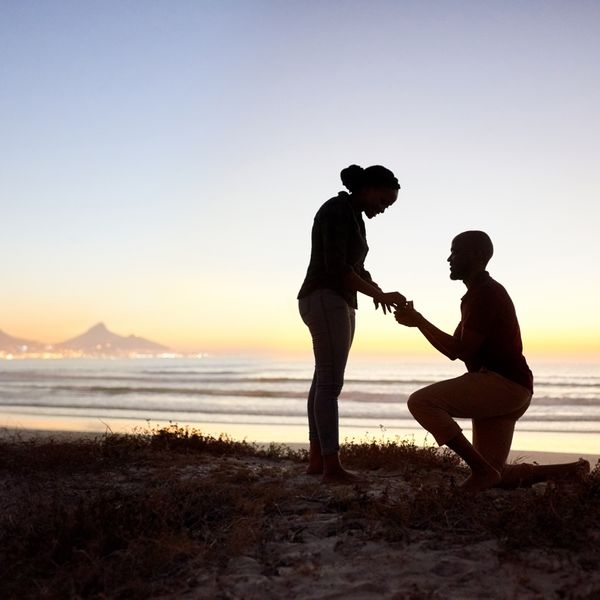 A couple proposing.