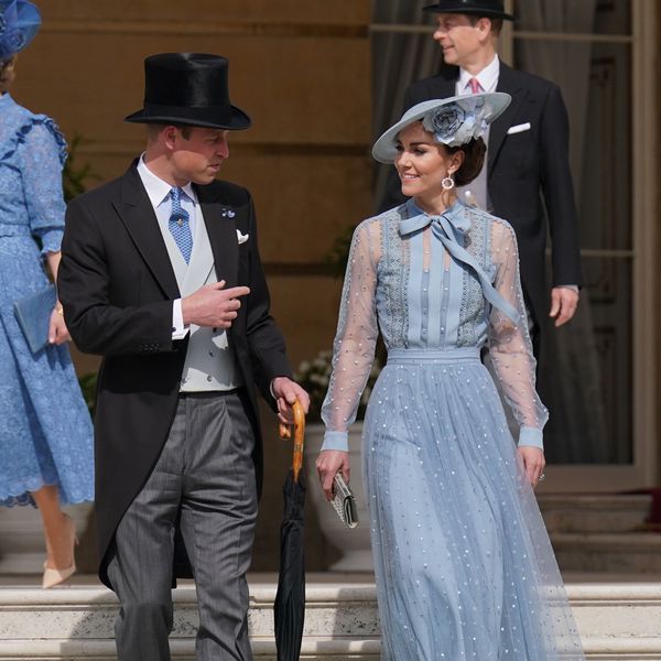 Kate Middleton and Prince William looking at each other at King Charles III's coronation garden party 2023