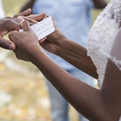 Closeup of couples exchanging vows at wedding 