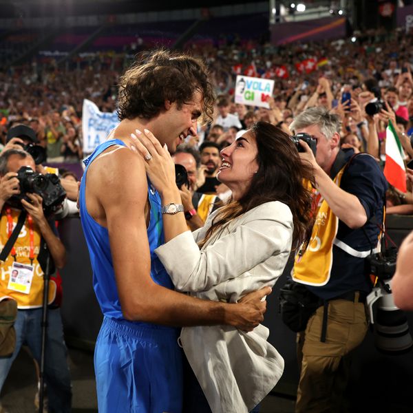 Gianmarco Tamberi of Team Italy celebrates winning the Gold medal with Wife Chiara Bontempi in the Men's High Jump Final