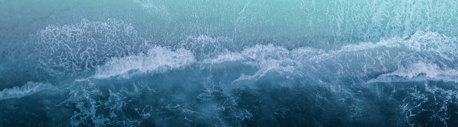 Image of waves on a beach, taken from above