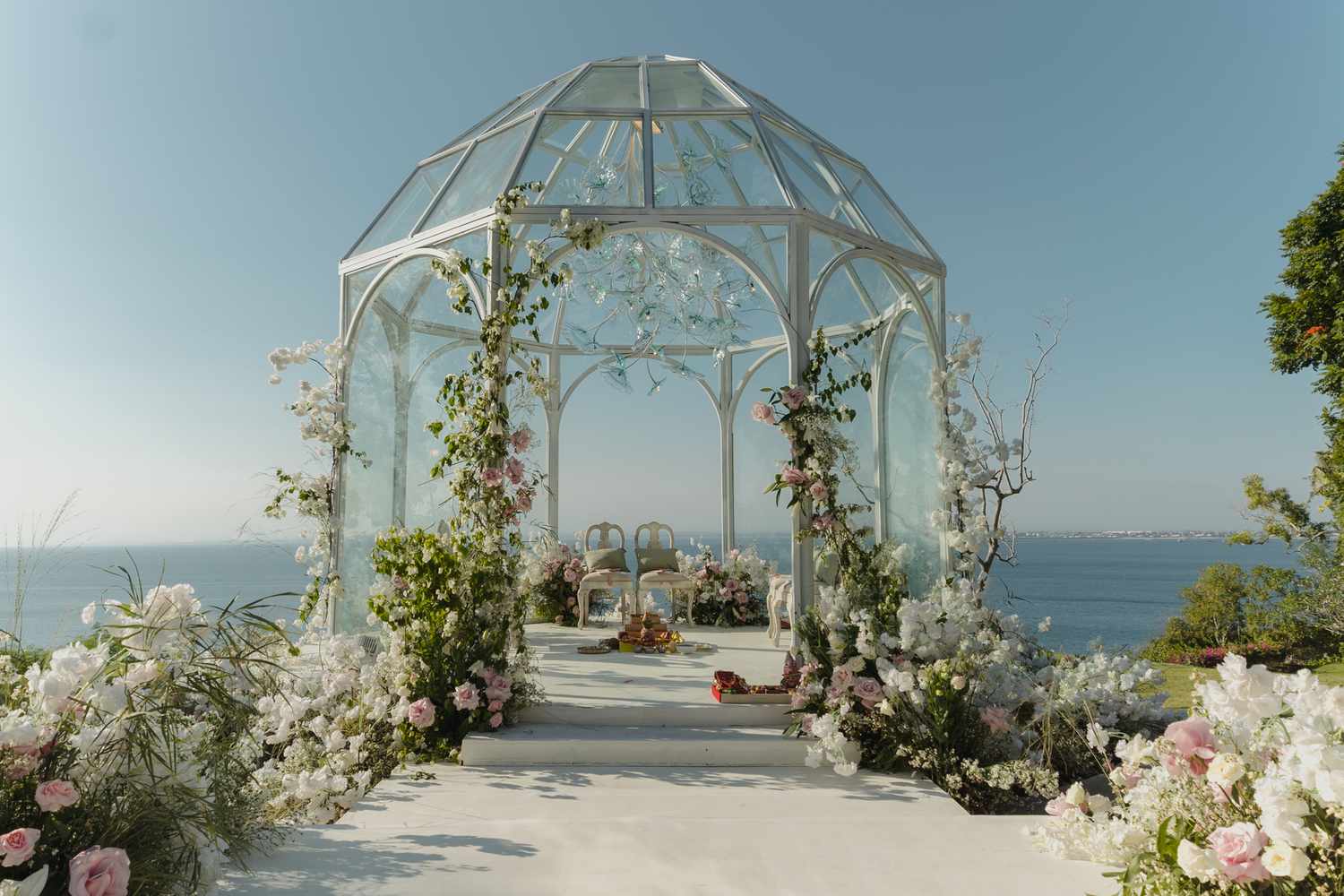 mandap with a clear roof photographed against the blue ocean