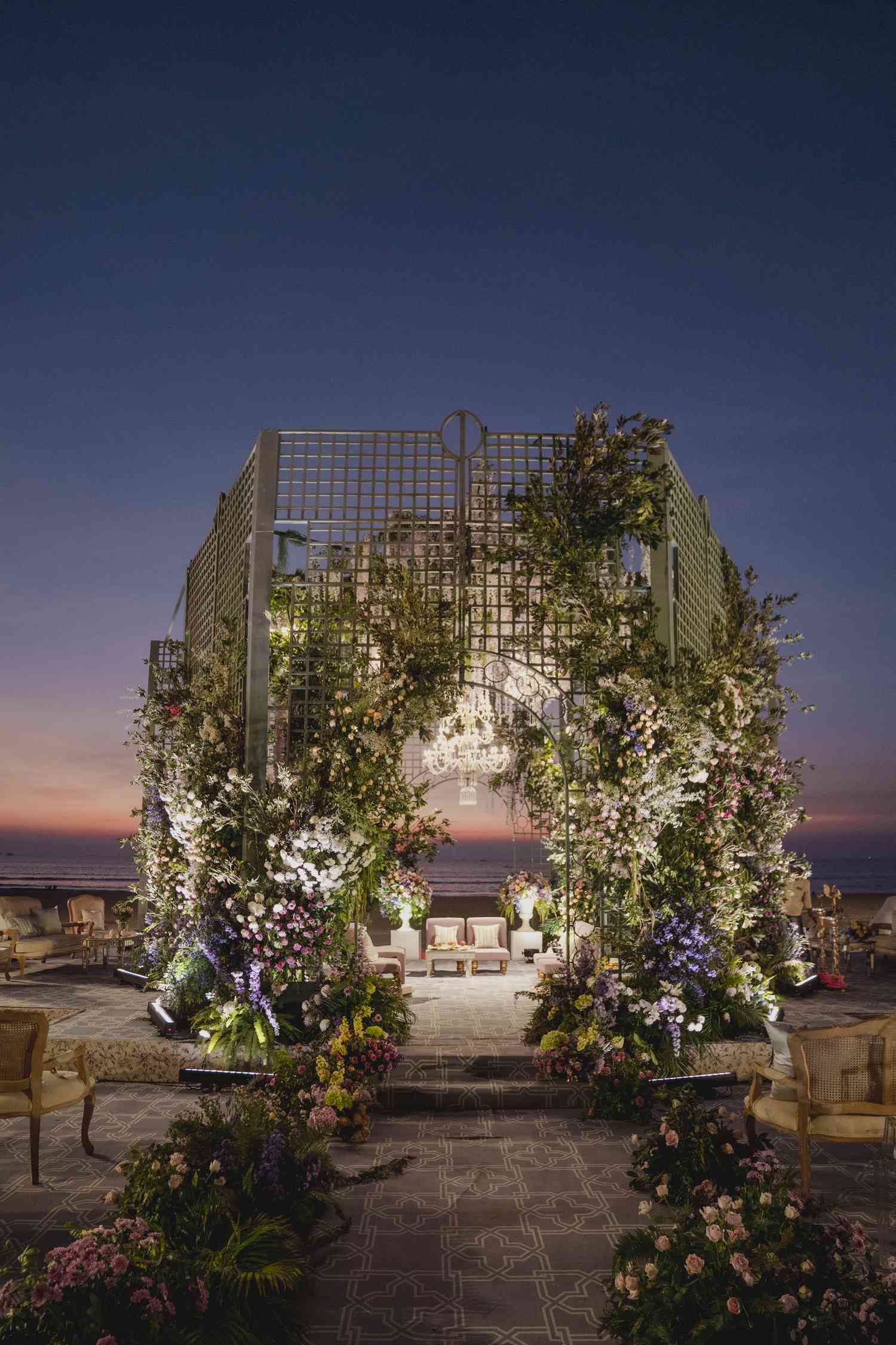 greenhouse-inspired mandap photographed at dusk