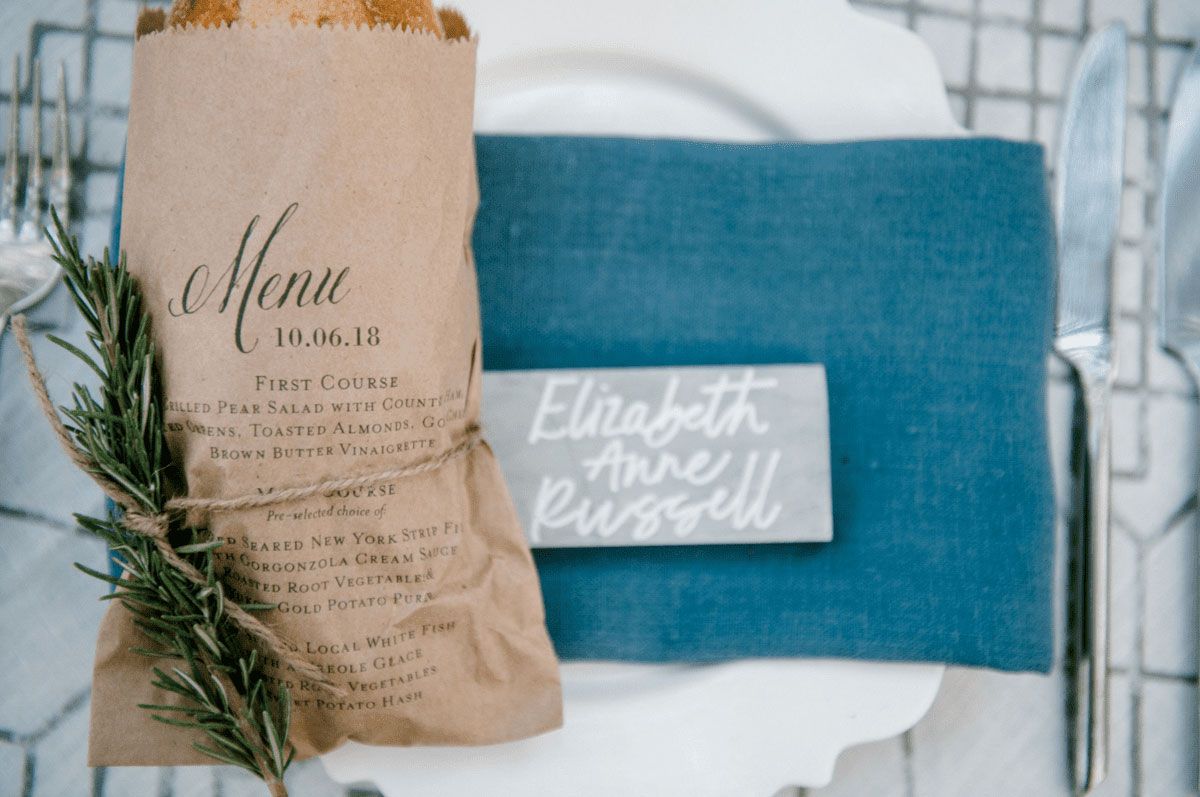 Rustic Menu baguette holder on blue place setting
