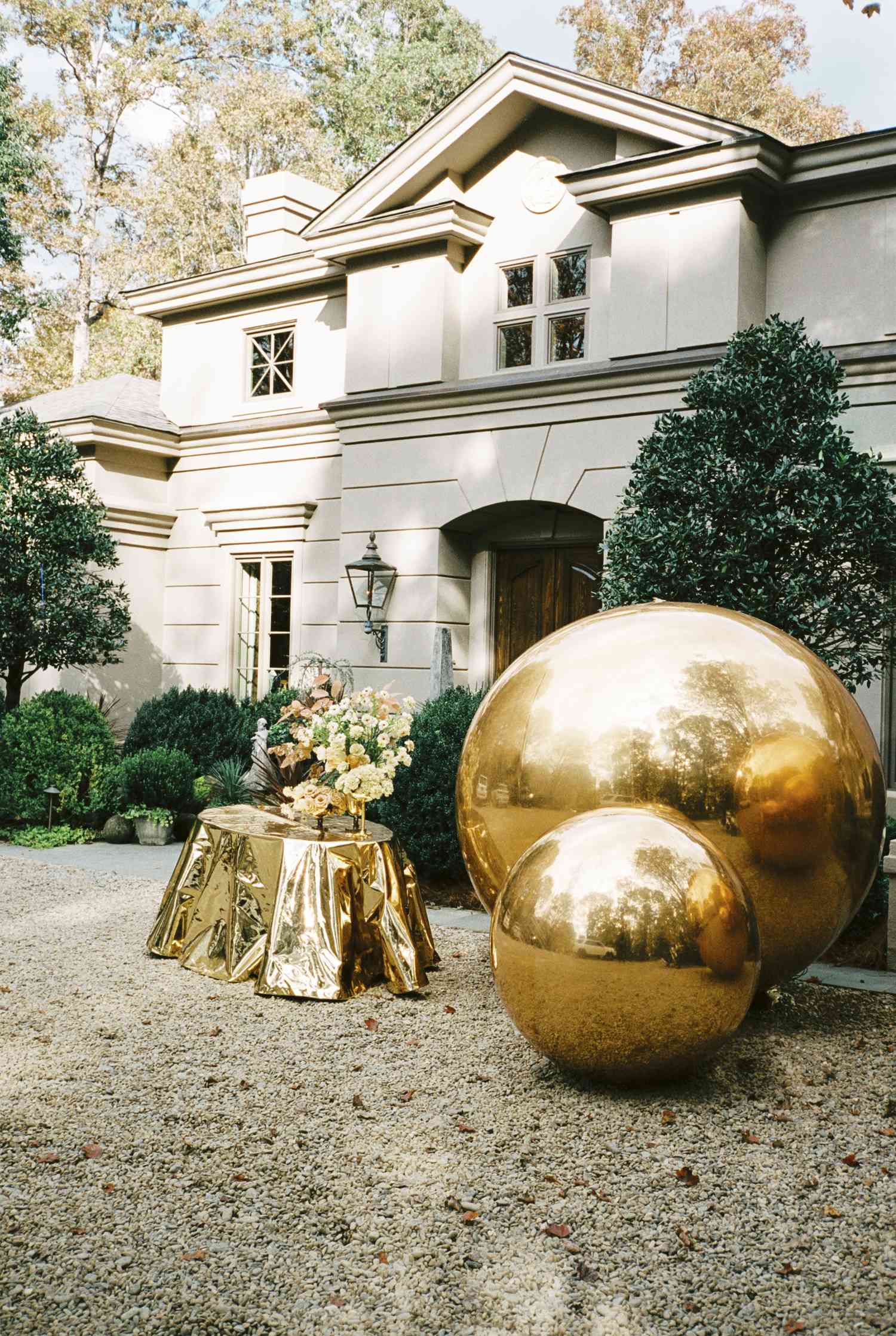 bride's parents house with gold metallic balls outside