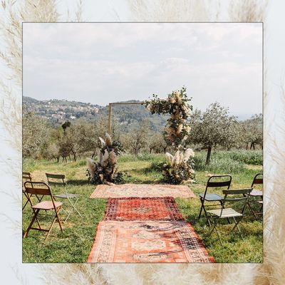 Ideas for a bohemian wedding ceremony with rugs and pampas grass