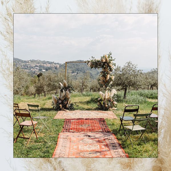 Ideas for a bohemian wedding ceremony with rugs and pampas grass