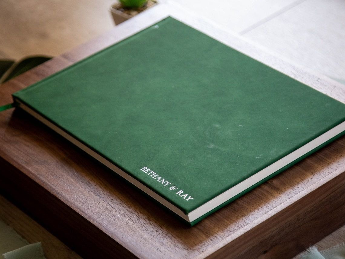 Embossed guest book in emerald green