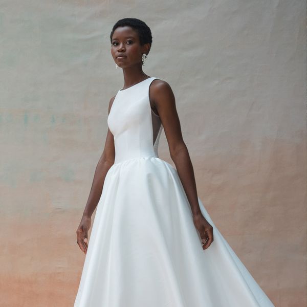 Fit and Flare White Wedding Dress With Short Sleeves and Pearl Earrings