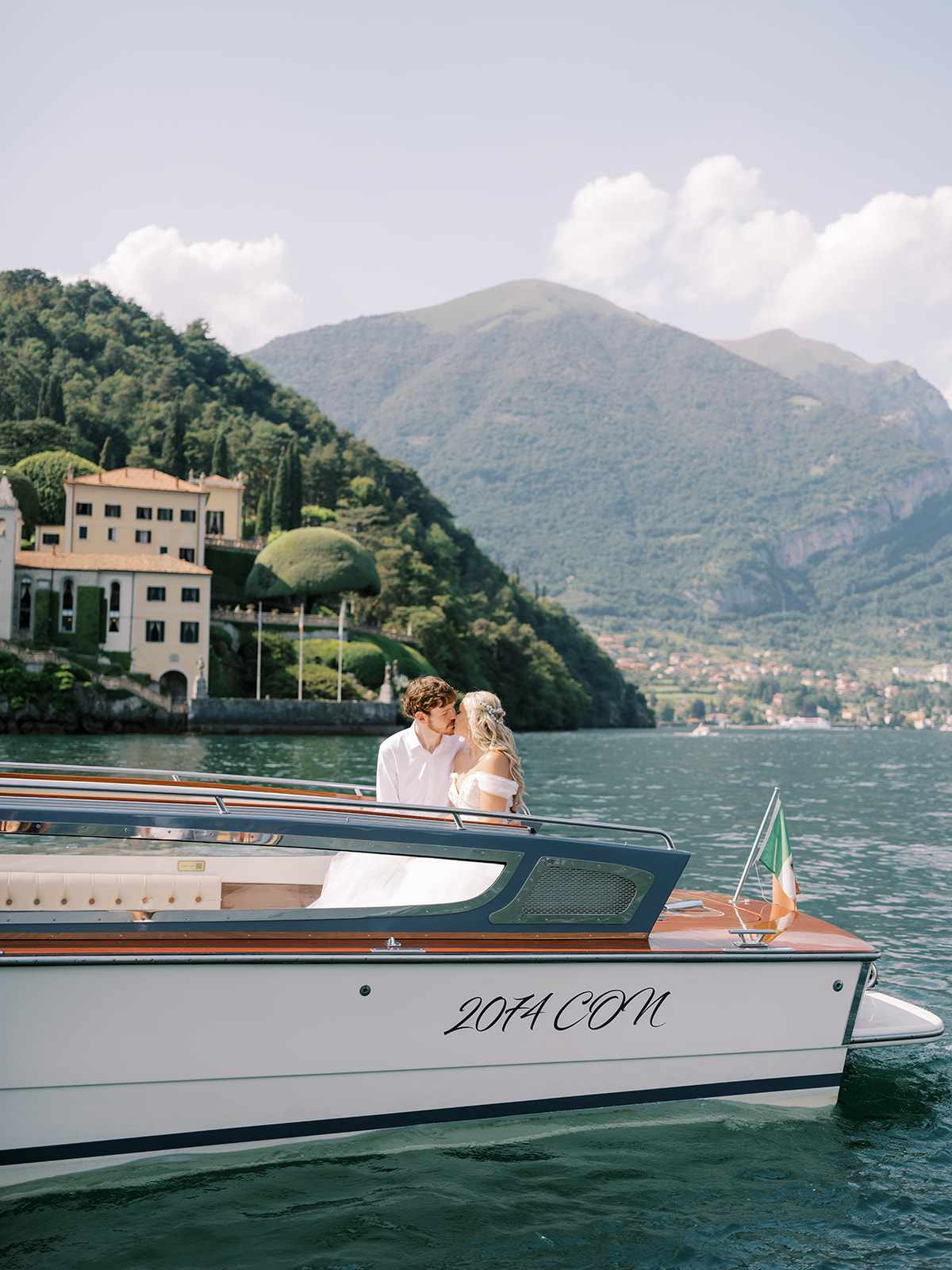 A Bride and Groom Take a Boat on Lake Como for Their Wedding Reception Entrance