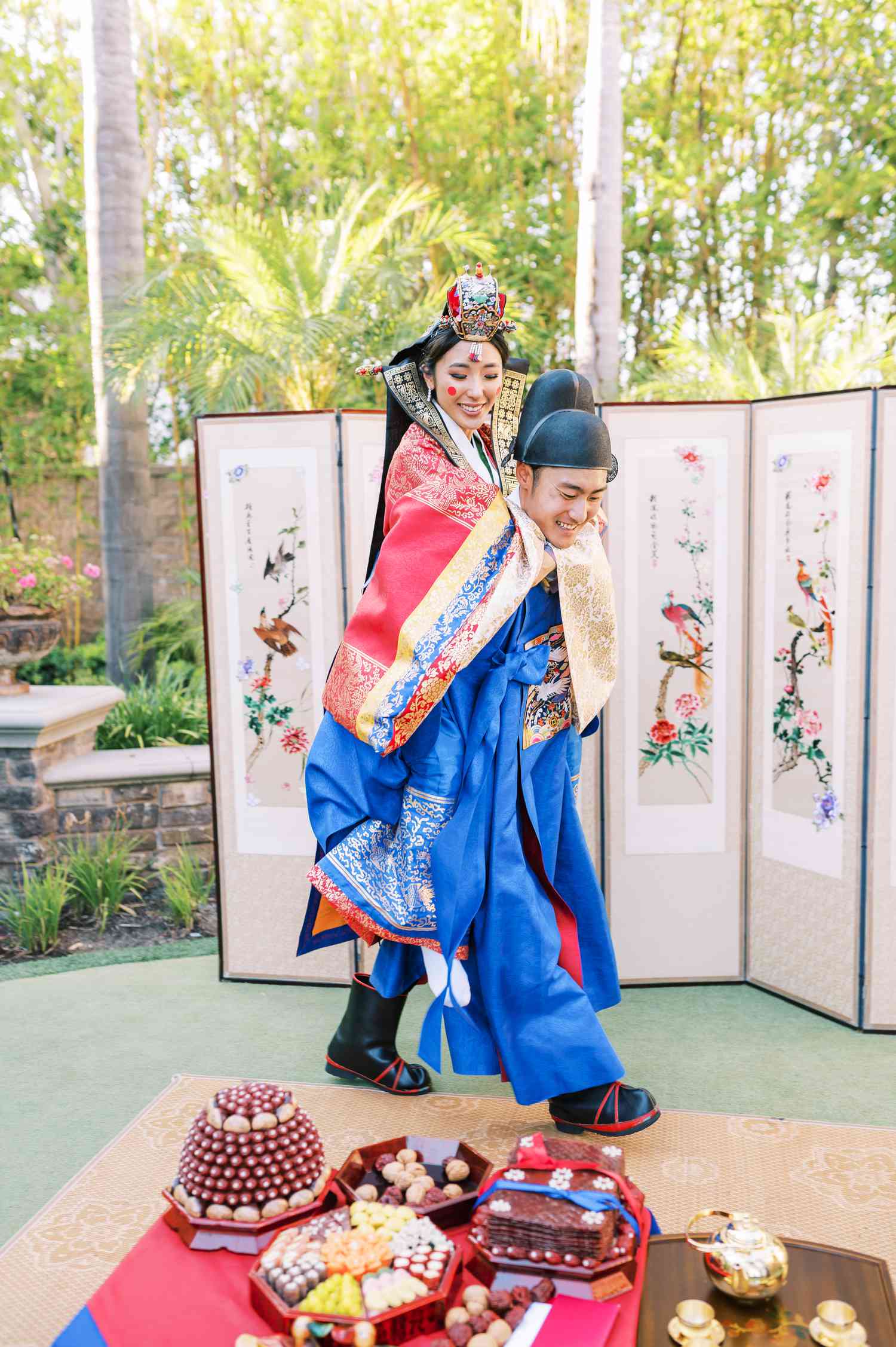 Korean Paebaek: brides getting a piggyback ride from her groom