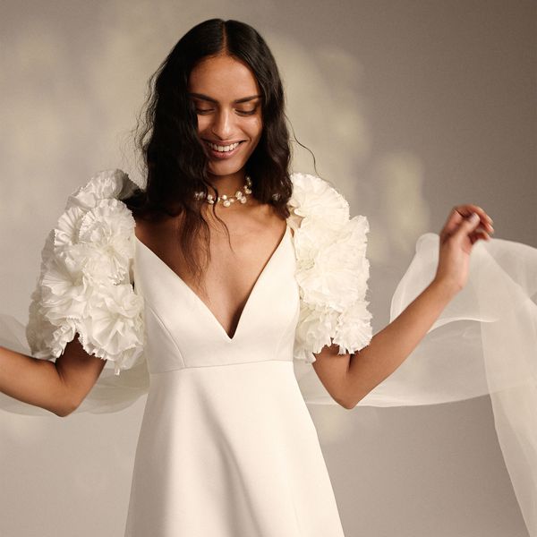 model wearing an A-line dress with 3D puff, floral short sleeves