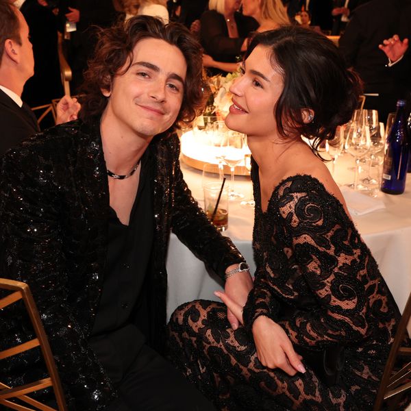 Timothee Chalamet and Kylie Jenner kissing at table at 2024 Golden Globes