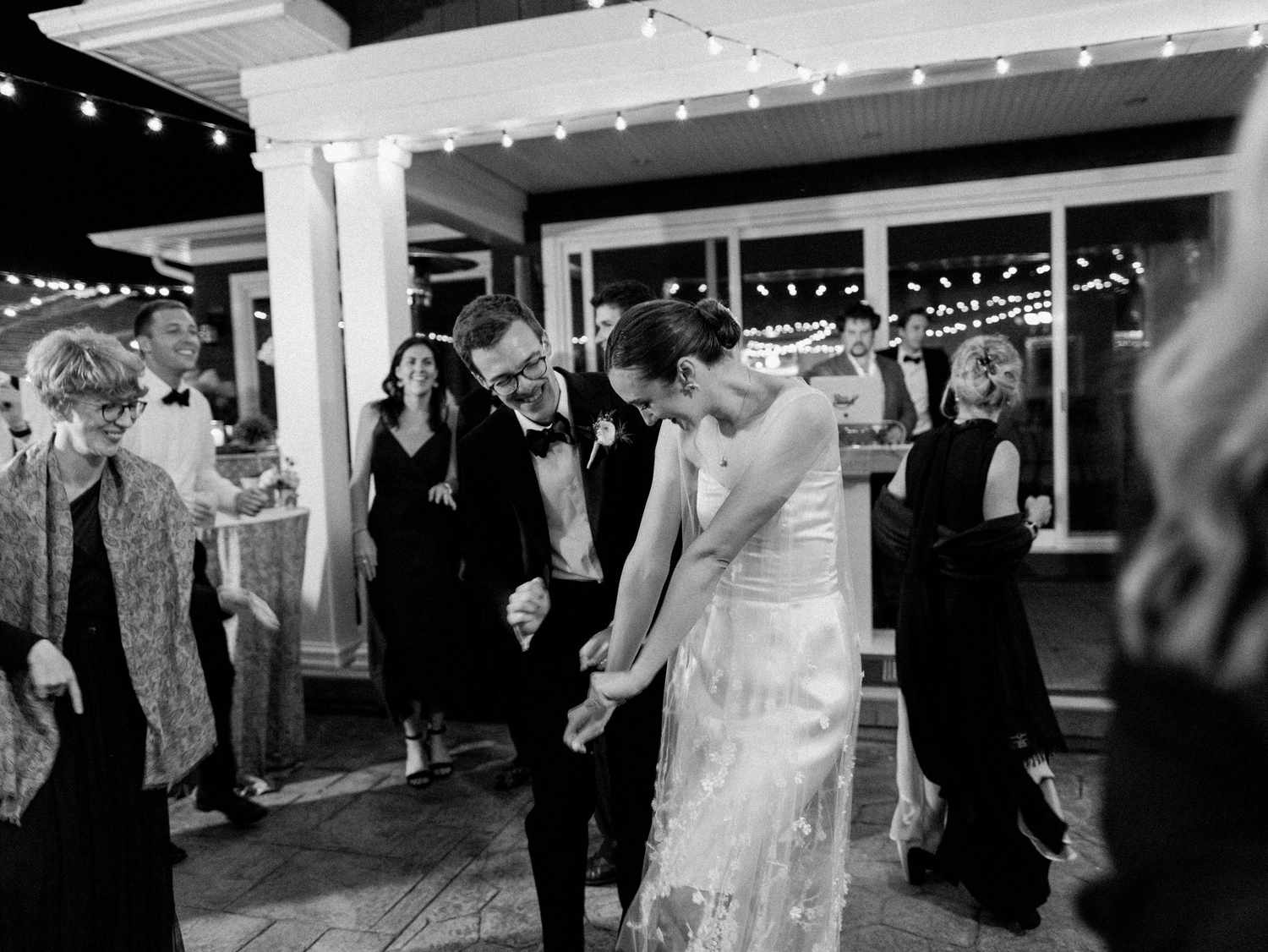 bride and groom dancing on patio at reception