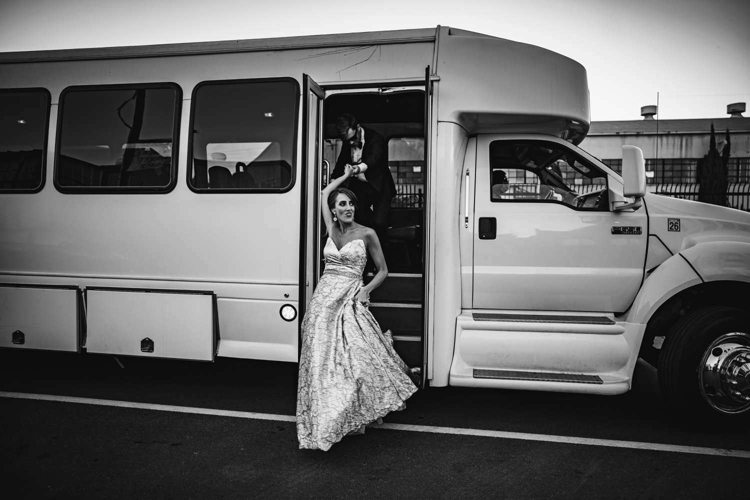 A Bride Walks Down the Steps of a Bus for Her Wedding Entrance