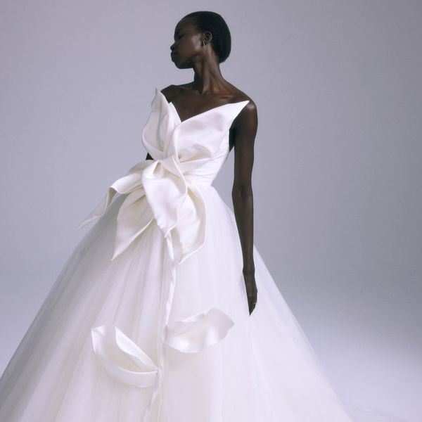 model wearing a wedding ball gown with an oversized floral bodice