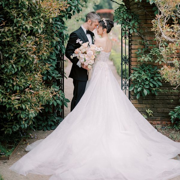 bride and groom smiling and looking into each other's eyes